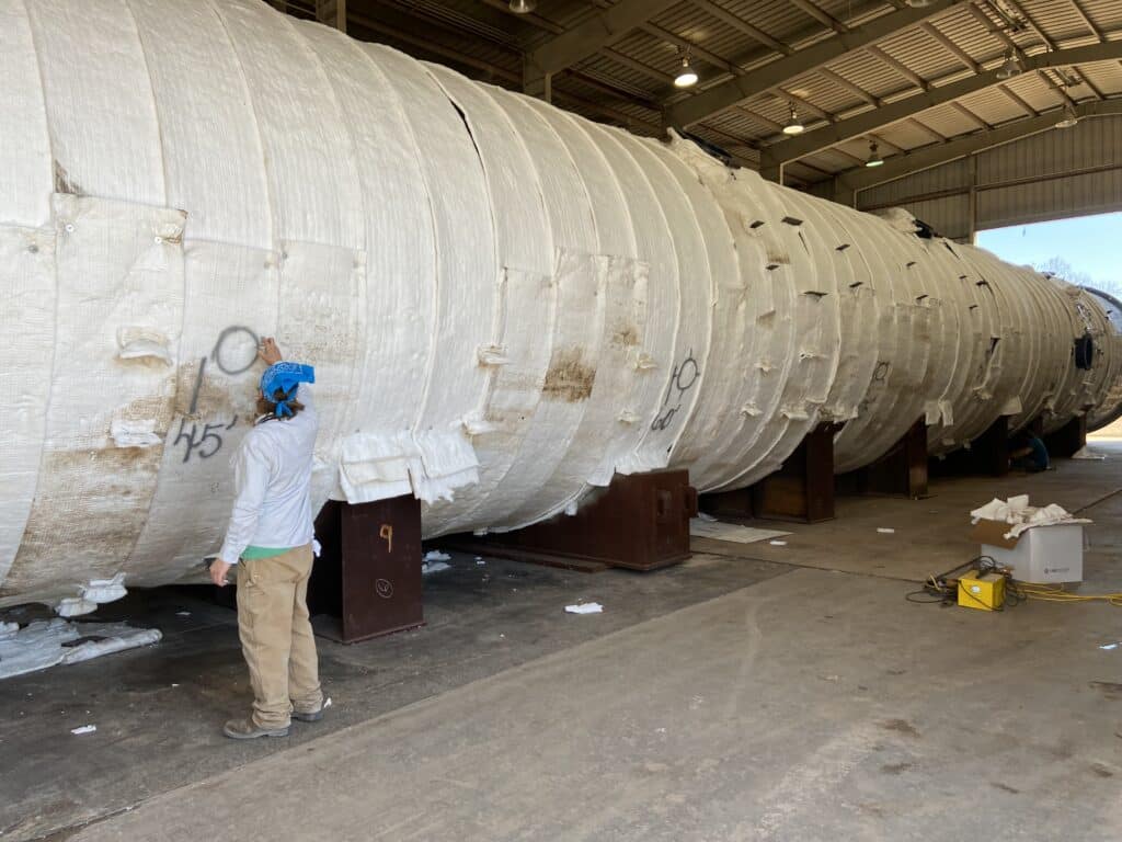 Gulf Coast Combustion technician wrapping 621000-pound pressure vessel in Kaowool insulation for on-site PWHT